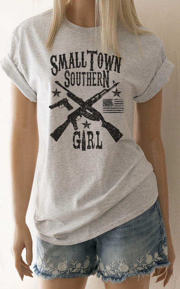 A heather grey t-shirt with the words Small Town Southern Girl, crossed rifles a pistol, a flag and stars. - Southern Girl Apparel® - southerngirlapparel.com