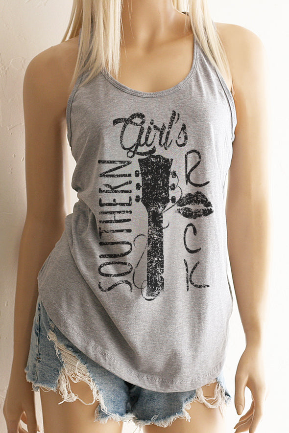 A blonde model wearing shorts and a heather grey racerback tank top with a black design with the words Southern Girl's Rock with  a guitar neck and strings in the middle. 