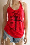 A blonde model wearing shorts and a red racerback tank top with a black design with the words Southern Girl's Rock with  a guitar neck and strings in the middle. 