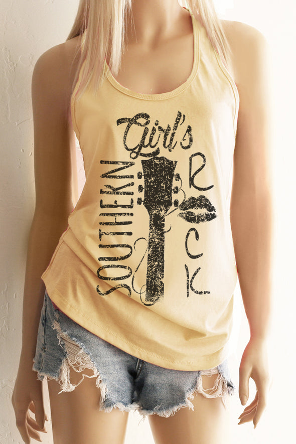 A blonde model wearing shorts and a yellow racerback tank top with a black design with the words Southern Girl's Rock with  a guitar neck and strings in the middle. 