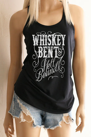 Pictured is a woman wearing a Black Racerback Tank Top with the Vintage styled Scripty lettering that says "Whiskey Bent & Hell Bound".