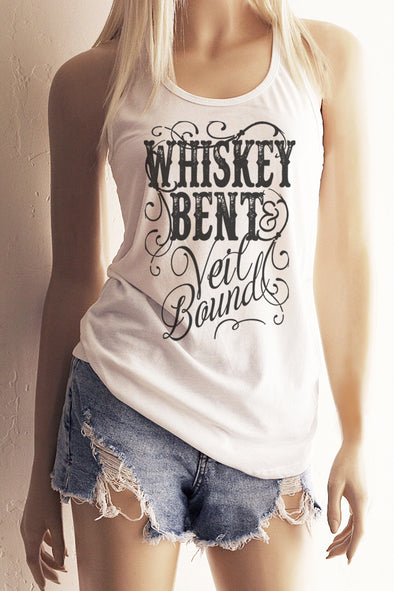 Pictured is a woman wearing a White  Racackerback Tank Top with the Vintage styled Scripty lettering that says "Whiskey Bent & Veil Bound".